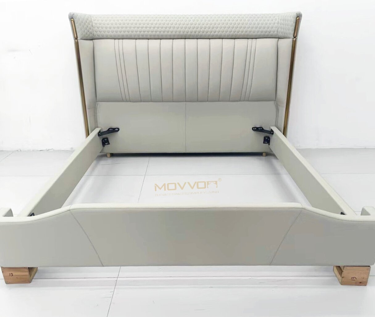 Ivory-Grey Pleated Upholstered Bed with Textured Headboard and Gold Side Rails